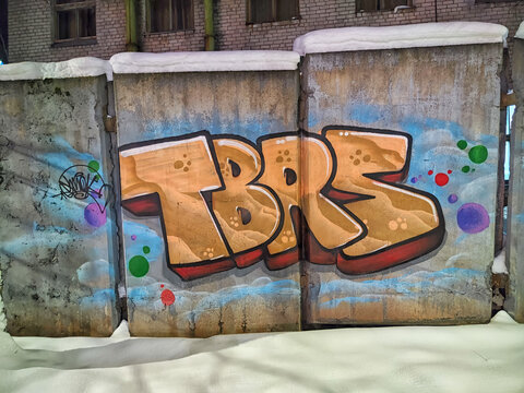 Kirov, Russia - December 20, 2023: Colorful Graffiti Art on Concrete Wall in Urban Area During Winter Day