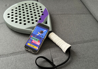 padel tennis and sports betting on a smartphone. Concept of sports bet