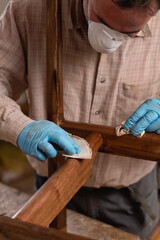 Process of coating wooden chair with protective lacquer