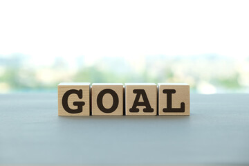 Goal text on wooden cubes with. Goal setting and business concept
