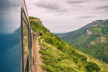 Journeying by train in Montenegro reveals stunning landscapes: forests, mountains, and tunnels...