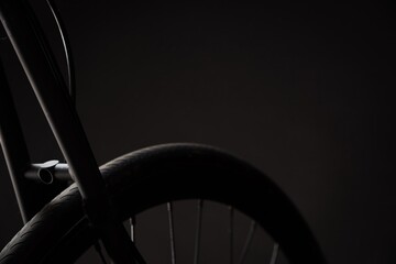 close up of bicycle wheel and bike frame