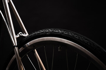 close up of bicycle wheel and bike frame
