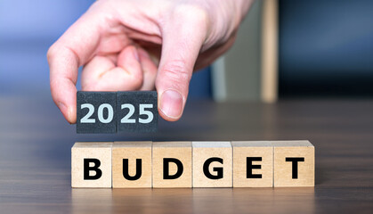 Wooden cubes form the expression 'budget 2025'.