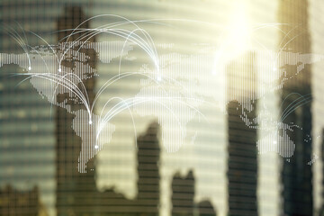 Double exposure of abstract digital world map hologram with connections on modern skyscrapers...