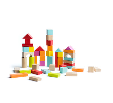 Houses made with toy blocks against white background