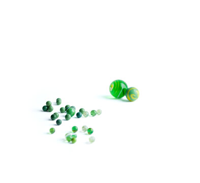Toy marbles over white background