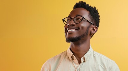 a handsome, smiling business guy wearing a shirt and glasses, feeling confident, isolated on a light yellow background