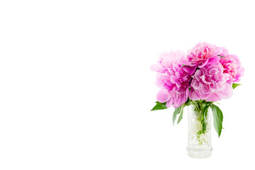 bouquet of pink peonies in a crystal vase