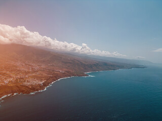 ocean shore with blue water and city Puerto De La Cruz, Tenerife, Canary island