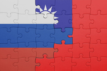 puzzle with the colourful national flag of taiwan and flag of russia.