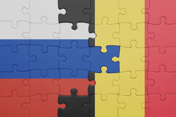 puzzle with the colourful national flag of belgium and flag of russia.