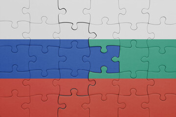 puzzle with the colourful national flag of bulgaria and flag of russia.