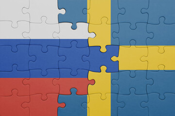 puzzle with the colourful national flag of sweden and flag of russia.