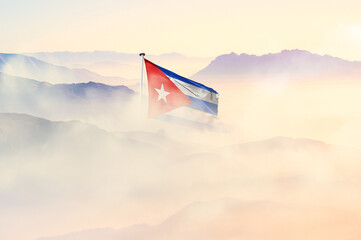Cuba flag disappears in beautiful clouds with fog.