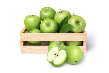 Green apple with green leaf in wooden box and cut in half slice isolated on white background.