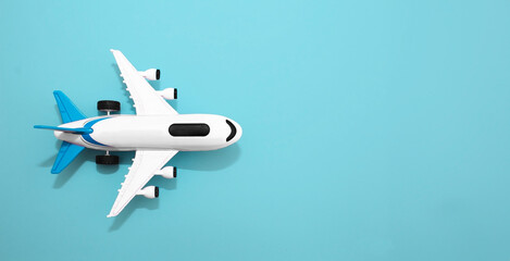 White airplane layout on a blue background. Summer vacation and plane travel, booking tickets