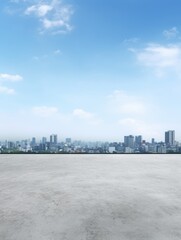 A city skyline with a clear blue sky. The sky is dotted with clouds, and the city is visible in the...