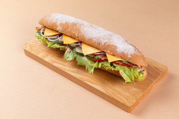 Panini sandwich with ham on a board.