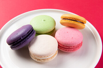 Various macarons in a plate.