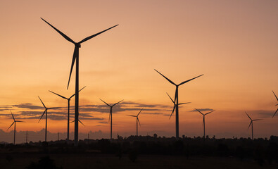 Fototapeta premium Windmills for electric power production, summer field, renewable energy