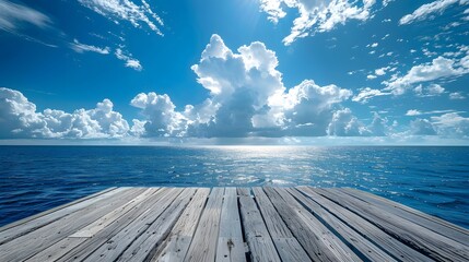 Wooden floor, blue sky and white clouds, sea background, blue ocean, perspective view of the wooden platform at one end of an open space on water, panoramic sea horizon.
