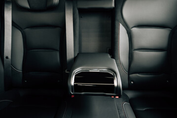 Fototapeta premium Back passenger seats with armrest electric car. Rear passenger seats.