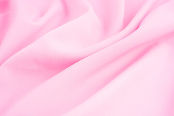 Abstract background luxury pink fabric with wavy folds, silk texture as background.