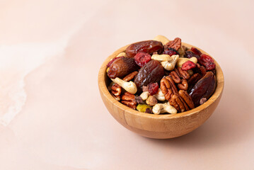 Natural raw foods ingredients and nuts arranged inside a bowl on a marble surface table in a flat layout copy space image place for adding text or design. World Pulses Day. African Raw Foods