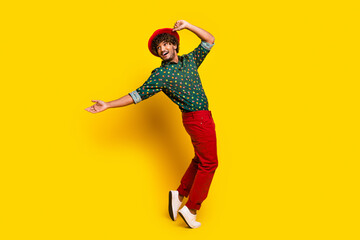 Full size photo of attractive elegant young man dancing wear shirt isolated on yellow color background