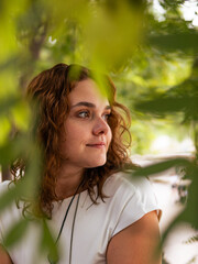 Young Woman Smiling in Outdoor Park Setting on a Sunny Day