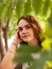 Young Woman Smiling in Outdoor Park Setting on a Sunny Day