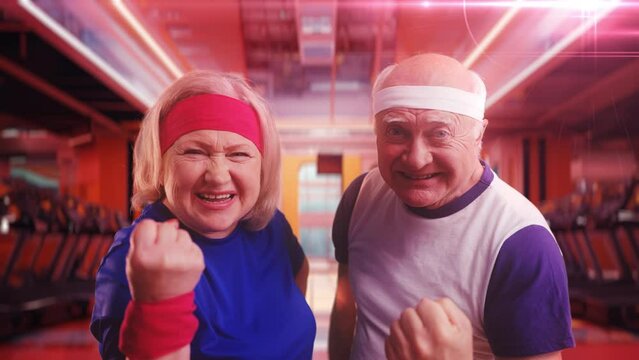 A comic senior couple in sportswear affirms positively with a yes gesture in a futuristic gym