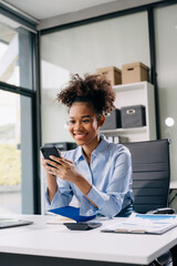 Confident business expert attractive smiling young woman holding digital tablet  on desk