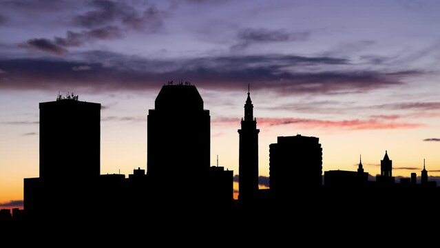 Massachusetts: Springfield downtown skyline at Twilight, Time Lapse with Colourful Sky and Dark Silhouette of Cityscape, USA