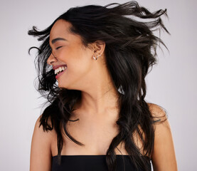 Salon, portrait and woman with hair flip in studio for growth, keratin treatment or shampoo on...