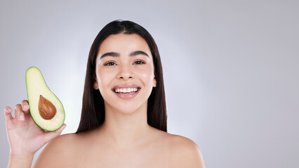 Portrait, beauty and woman with avocado, skincare and dermatology on white studio background. Face,...