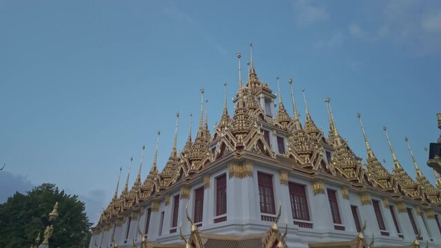 Wat Ratchanatdaram Worawihan (Loha Prasat).The Loha Prasat is an amazing building with an iron roof made of 37 spires signifying the 37 enlightenment virtues of Buddhism.The spiers of golden castle