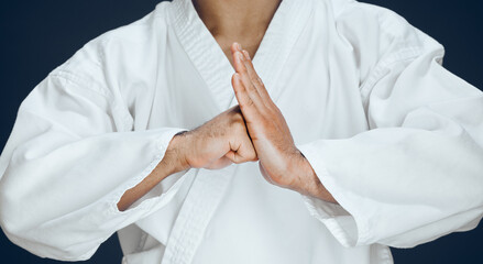 Man, hands and karate form in studio, fighter and ready for training or practice on dark...
