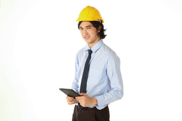 Portrait of young engineer wear helmet smiling and happy with tablet over white background