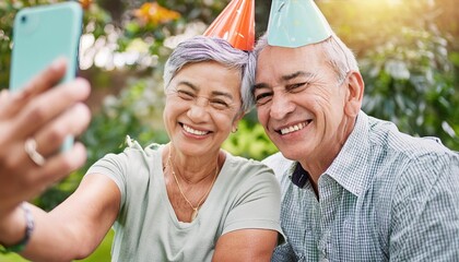 Obraz premium Elderly, couple and happy with video call at birthday party for celebration, laughing and memories in garden
