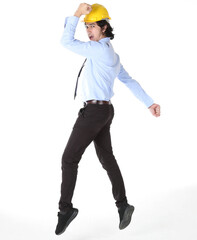 Portrait of young engineer wear yellow safety helmet prepare jumping in the air and looking at camera over white background
