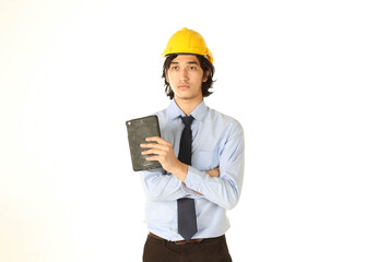 Portrait of young engineer wear helmet smiling and happy with tablet over white background