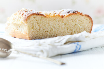 Simple yeast cake on bright background. Front view. Close up.