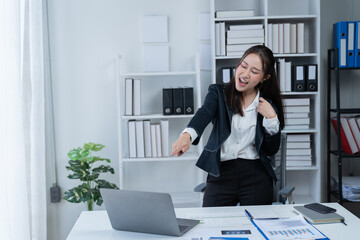 Happy businesswomen working at the office 