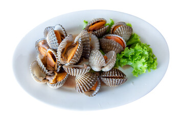 Top view of Steamed blanched clams with lettuce, focus selective