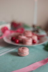 pink macarons served with cherries 