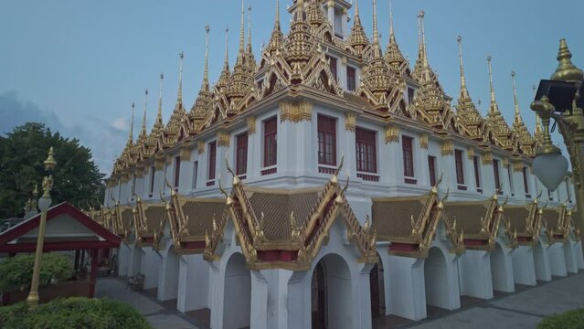 Wat Ratchanatdaram Worawihan (Loha Prasat).The Loha Prasat is an amazing building with an iron roof made of 37 spires signifying the 37 enlightenment virtues of Buddhism.The spiers of golden castle