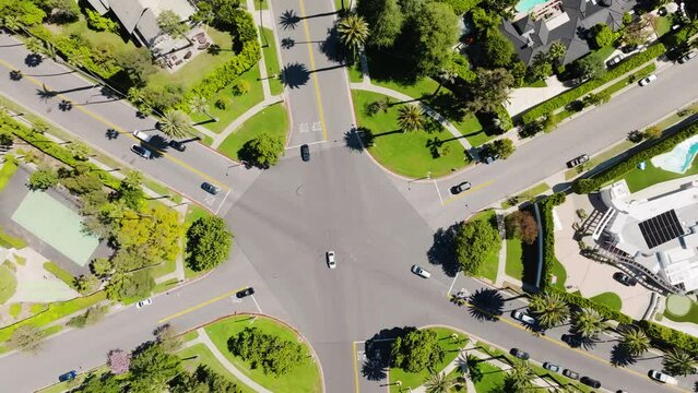 Beverly Hills Aerial 2024 - Top down and rising to reveal streets and famous intersection 