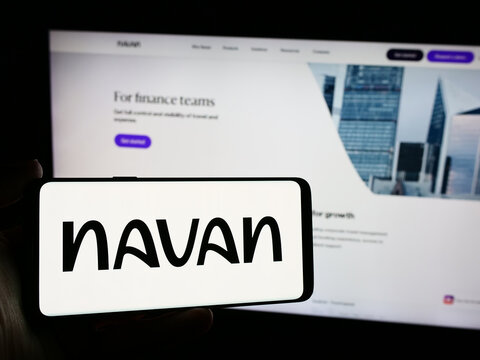 Stuttgart, Germany - 05-17-2024: Person holding smartphone with logo of American travel management software company Navan Inc. in front of website. Focus on phone display.